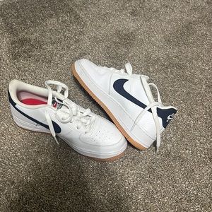 Nike Air forces with navy blue nike sign